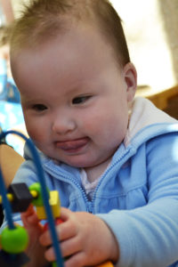 baby concentrating on puzzle