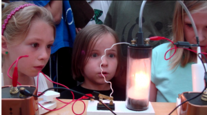 students look at experimental light bulb set up