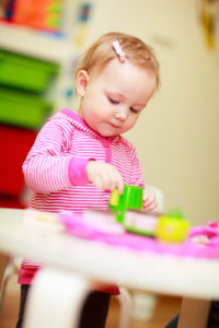 Toddler playing with toys