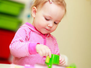 toddler playing with toy