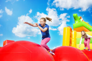 Girls playing on big inflatable