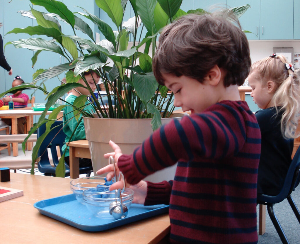 child practicing hand dexterity