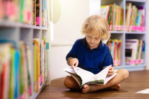 young boy reading