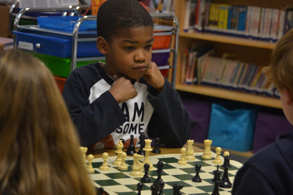 boy playing chess