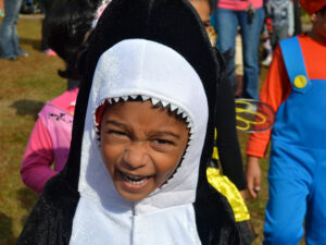 Little African American boy dressed as a shark for halloween