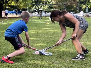 a girl an a boy playing lacrosse at The New School Montessori Center