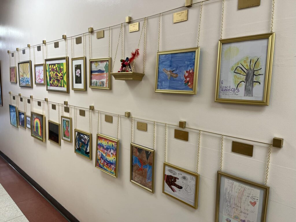 New School art gallery of student's art on the wall