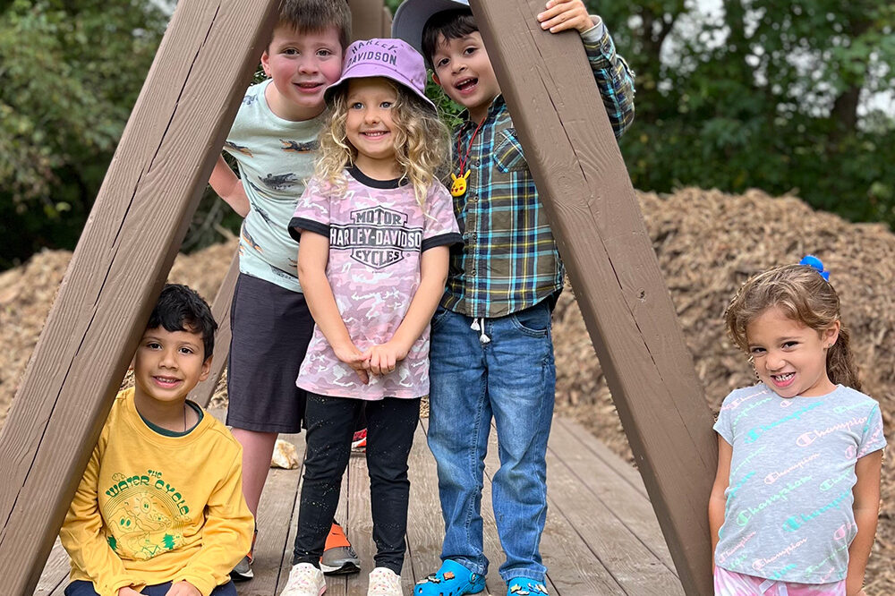 young children on a zip line platform