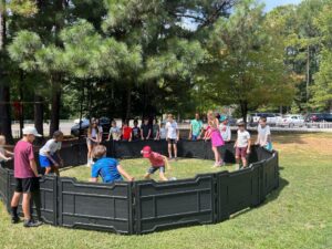 children playing in a gaga pit at The New School