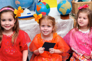 Three girls at The New School International Night Event dressed in Thai outfits