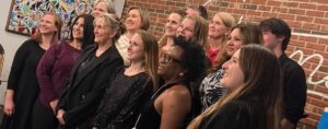 Row of teachers and staff at The New School gala and silent auction