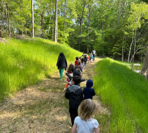 Children walking on long trail at The New School