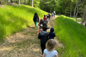 children walking on a trail for summer camp at The New School Montessori Center